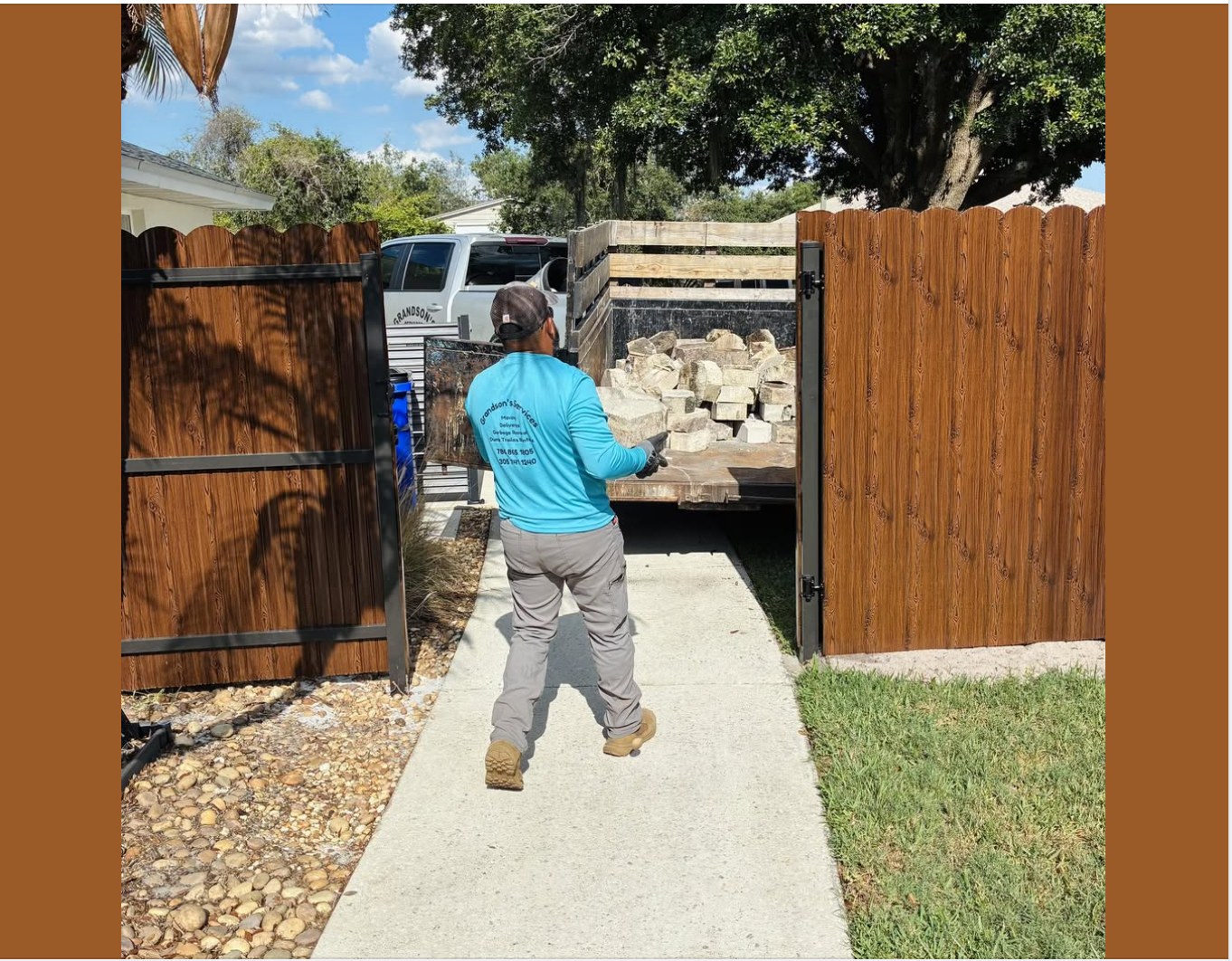 Crew loading concrete debris into a dump trailer